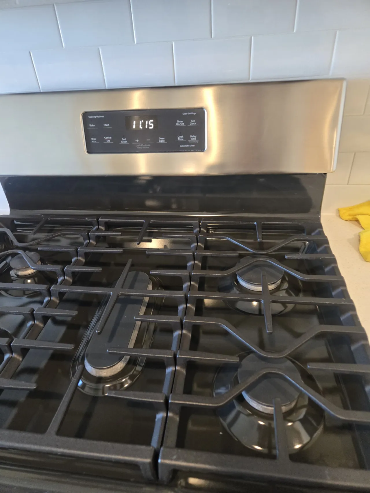 Gas stovetop cleaned during a rental turnover in New Jersey